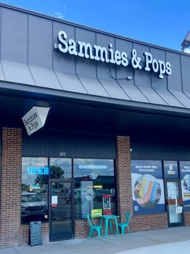 The illuminated Sammies & Pops storefront at 3112 Van Horn Road